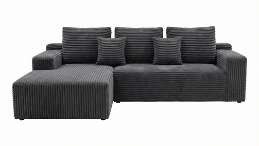 Gray sectional sofa with striped cushions on a white background